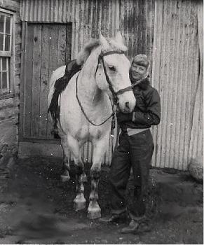 fifteen year old Evelyn next to her horse
