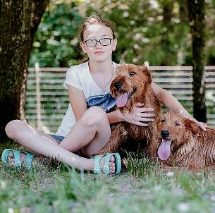 girl with two dogs