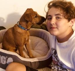 irish terrier puppy with young woman