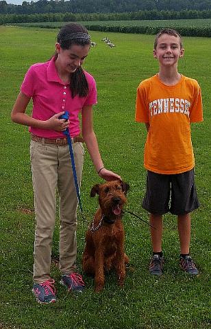 sister and brother with their dog